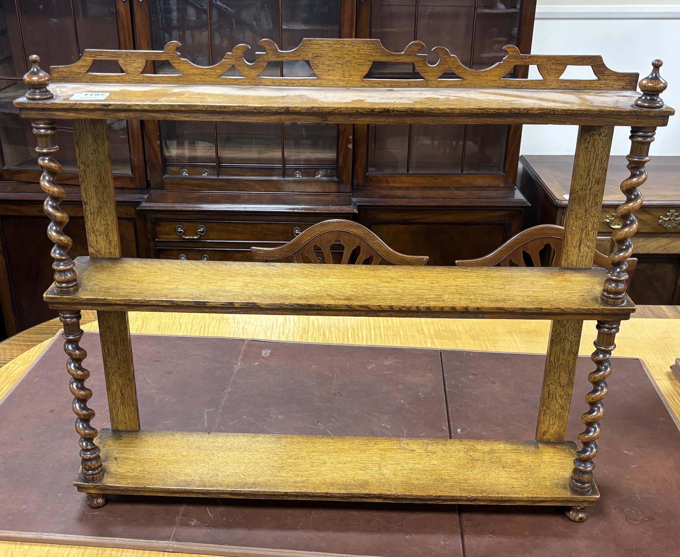 A Victorian oak three tier wall bracket, width 76cm, depth 14cm, height 65cm